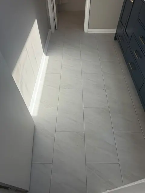 Large-format porcelain floor tile installation