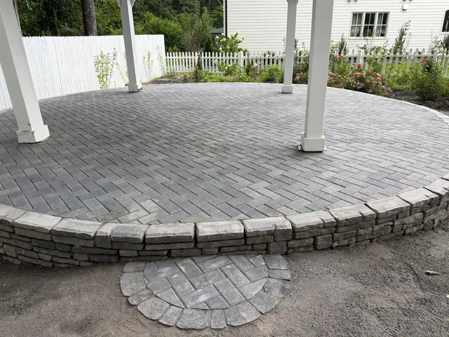 Circular paver patio with stone border