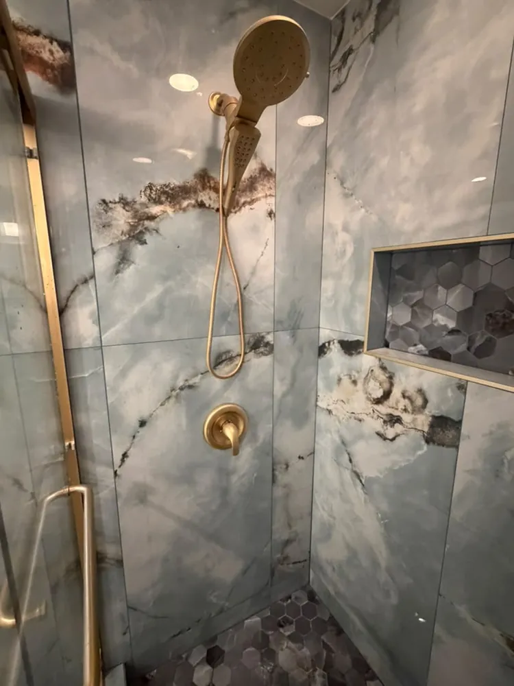 Custom tile shower with gold fixtures by ACP Tile